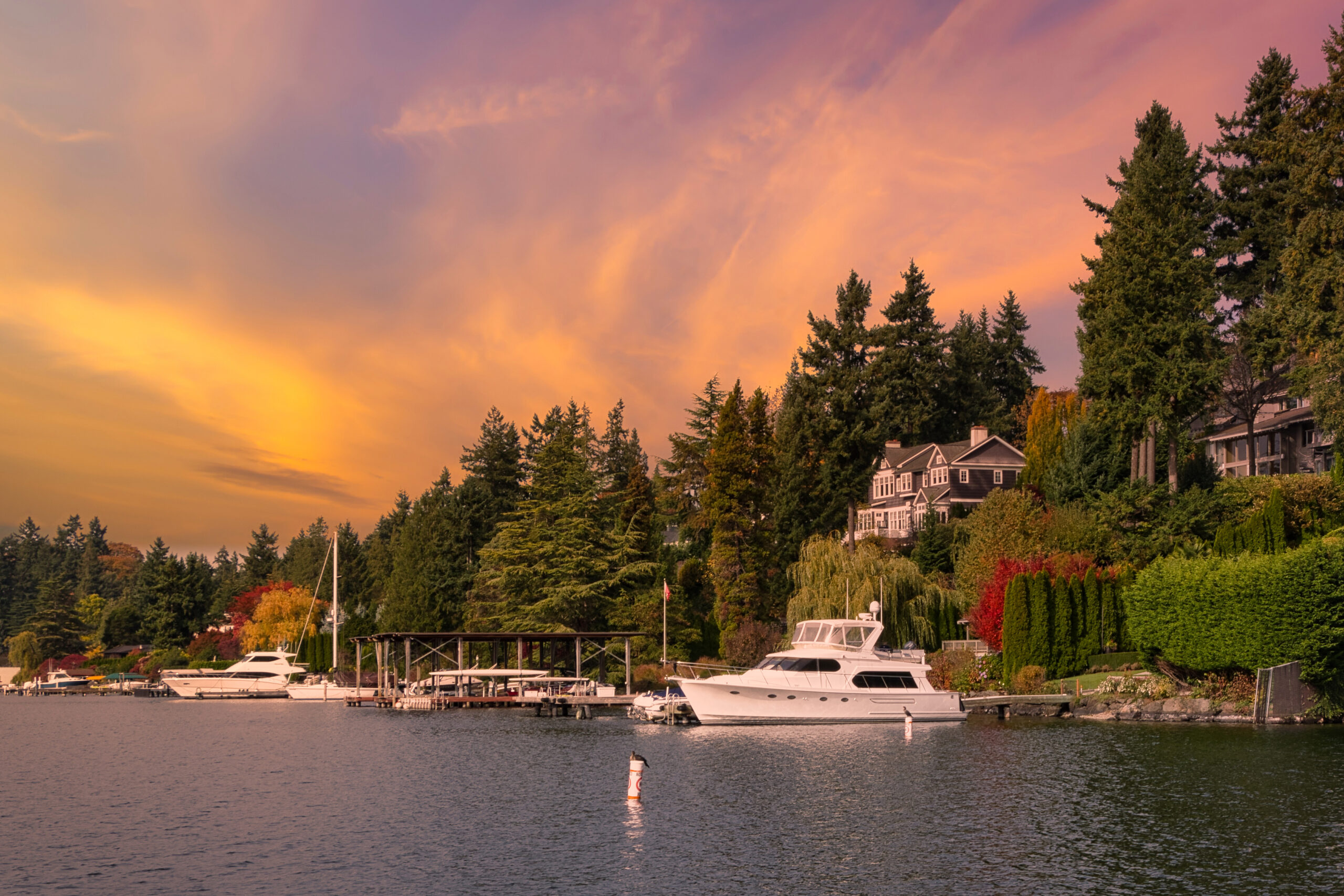Waterfront homes and boats in Lake Forest Park, WA at sunset